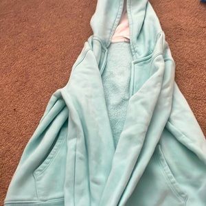 This teal Amazon essentials zip up is the perfect addition to your closet.